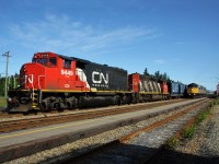  Bathurst Mines train with CN GP40-2LW 9449 and SD40-2W 5251 waiting for the VIA Rail to go by. VIA's lead unit F40PH-2 6424. August 08, 2009.