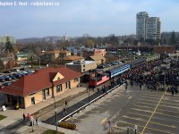 <b>Lest we forget</b> on this sombre Remberance Day in 2015, a large crowd has gathered at the Waterloo cenotaph for a memorial ceremony remembering those who have served and paid the ultimate price defending our freedom. A special train for veterans and their families was brought down to shelter them from what was promising to be a rainy day, but the rain held off. I don't think this is happening again this year - the WCR website does not allude to this event occuring - special permission was granted by Grandlinq for the 2015 move - while the LRT isn't operating yet - this time next year it will be.
<br><br>
In one of my posts earlier this week, I posted a photo at the 1990's buitl WSJR station. This is the real ex Grand Trunk station, built in 1910 and now is a Men's clothing store - Paul Punchers. Punchers also has a ex CNR caboose on-site. <br><Br>
Photo notes: NOT a drone photo.