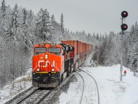 With a not particularly interesting consist on the point, Coquitlam-BIT train Q108 cruises over the west switch at Medicine Lodge amongst a winter wonderland. 