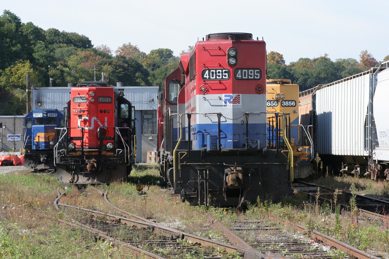 This photo is a great example of how a time span of 8 years can really make a difference in the railway industry. Taken down in the "Hammer" in October 2008, at Stuart St. Yard, rests quite the variety of power. From left to right: RLK 3873, CN 7001, RLK 4200 & slug RLK 1200 (behind the CN locomotive, out of view, uncoupled), RLK 4095 (now with GEXR and no longer with "RailAmerica" decals), GEXR 3835 (coupled to the 4095, out of view) and GEXR 3856. Wow! Many of the locomotives pictured here are no longer in Ontario in operation. Maybe CN 7001 is on the CN roster still, and RLK 4095 is, as of lately, coupled to QGRY 2008 powering the GEXR locals (518 and 580). This scene pictured here has also changed significantly, as evidence, see other RP.ca contributors' recent shots of this area.

I will admit, I do not have the extensive locomotive history knowledge like others do, for various reasons that I won't get into here. So, I welcome others to discuss their histories, if they see fit.