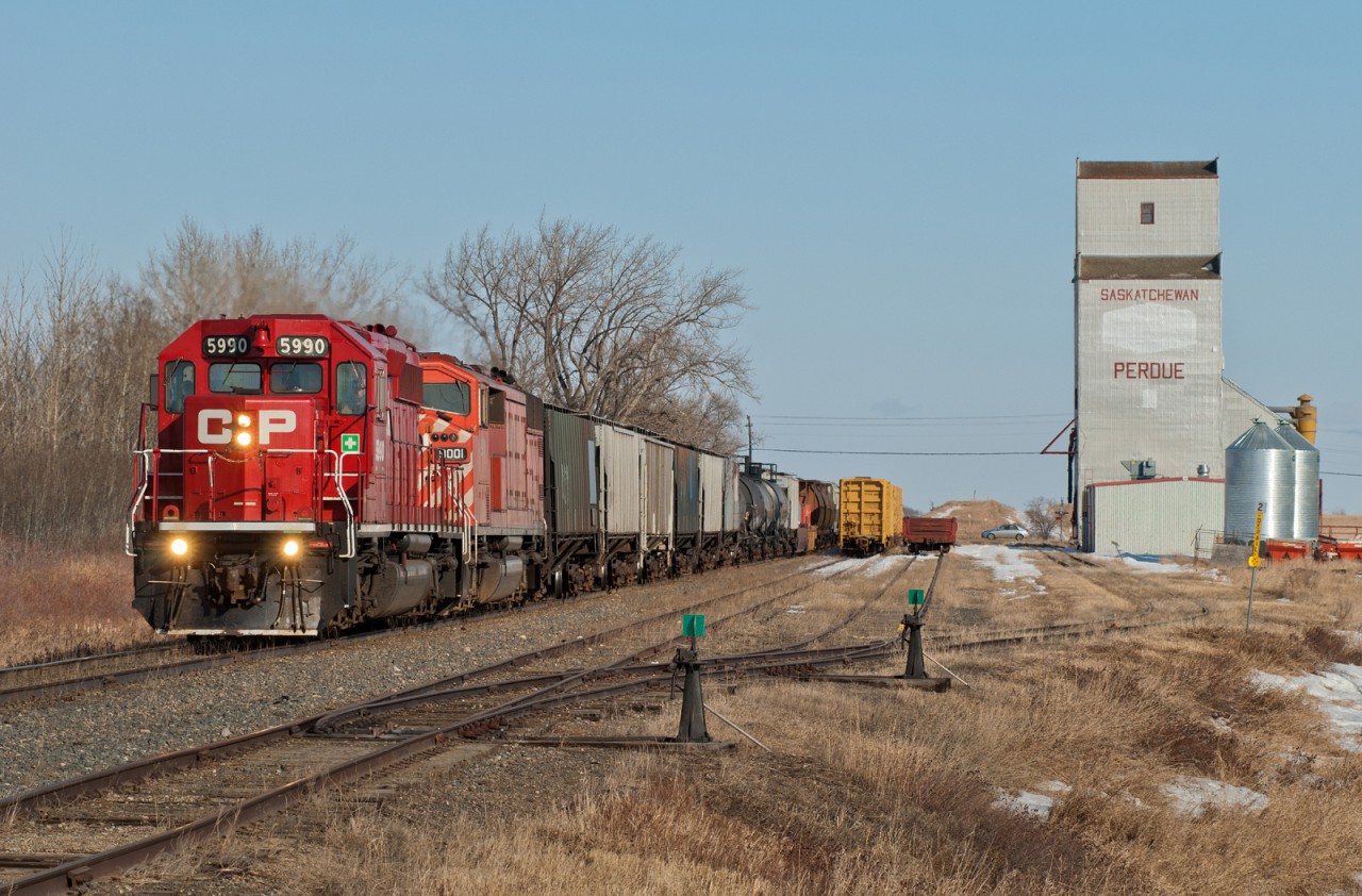 CP's daily Sutherland (Saskatoon)-Calgary train 457 passes the elevator at Perdue Saskatchewan.  Perdue is located along CP's Wilkie Subdivision.
