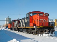 CN 1410, 1405, and caboose 79431 are seen on one of the many industrial spur's in Saskatoon's north end on a bone chilling -44C day. 