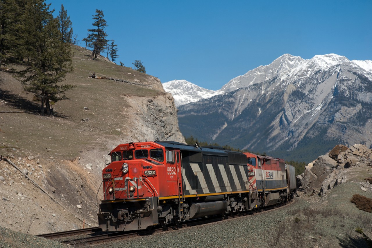 CN 5532 and BCOL 4614 are seen on the point of train 347 between Jasper and English on a beautiful spring day in the mountains.