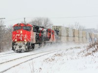 Winter has arrived, Q149 rounds the curve at the east end of Ingersoll. With Consecutive numbered ET44AC's. 3050,3049 and 2018 take charge on this Chicago to Montréal hot shot.