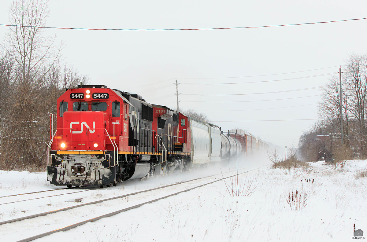 CN 5447 and 2161 do the honors and head east on M385.