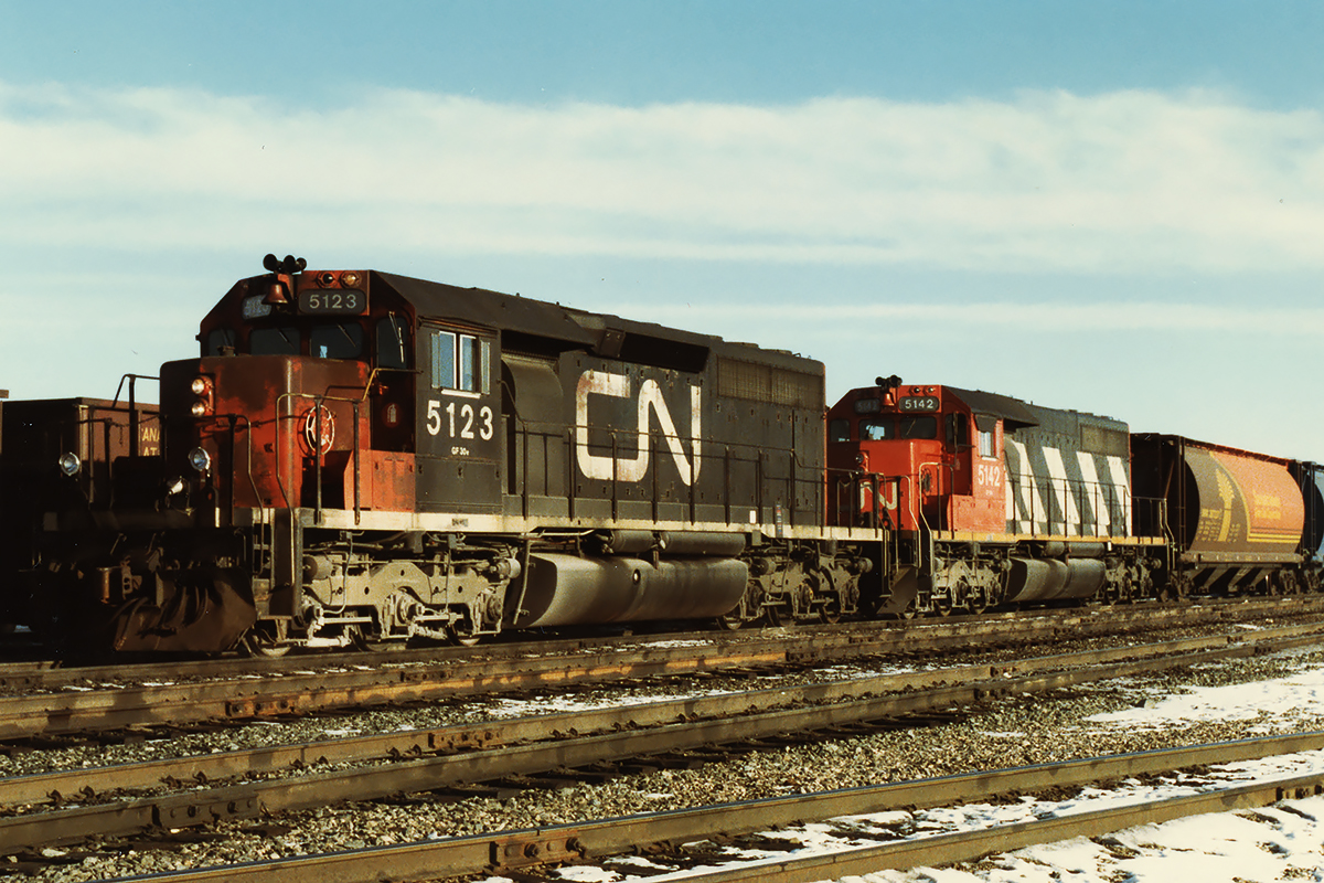 A 16 week stint loaned to CN's western division during an eastern layoff led me to Edson; not a scenic capital of Alberta. A lot of downtime led to watching trains hoping for a next call that rarely came. On the upside, these 2 SD40's taking yet another grain train to the west coast. The Edson Sub was crazy busy at night with double track and CTC projects to the west (much ripped up by a short sighted Hunter), but work blocks left things pretty quiet during the day.