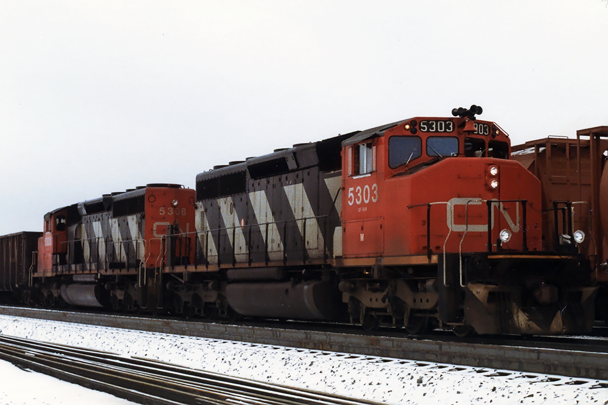 A couple of SD40-2W, my favourites, pull an eastbound junker in Edson for a crew change.