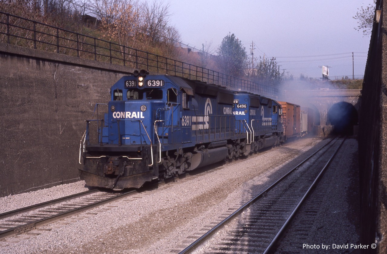 Conrail YDLW-1 (Yard-Detroit Livernois-Windsor) with SD40-2's 6391-6496 charges out of the East Tube of the Detroit River Tunnel into Windsor, Ont on Nov 3rd 1980.