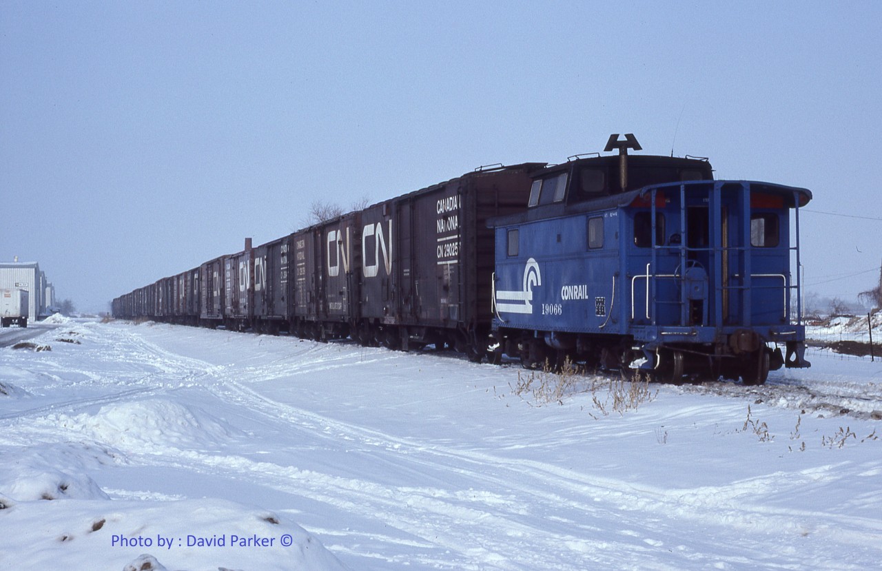CR 19066 brings up the rear of WQLE-1 as it makes its way North on the Leamington Branch with a trainload of soup and ketchup from the Heinz plant in Leamington Ont. Jan 23rd 1981. The train will join up with the Canada Division mainline at Comber where the cars will be lifted by WQWI to St Thomas.