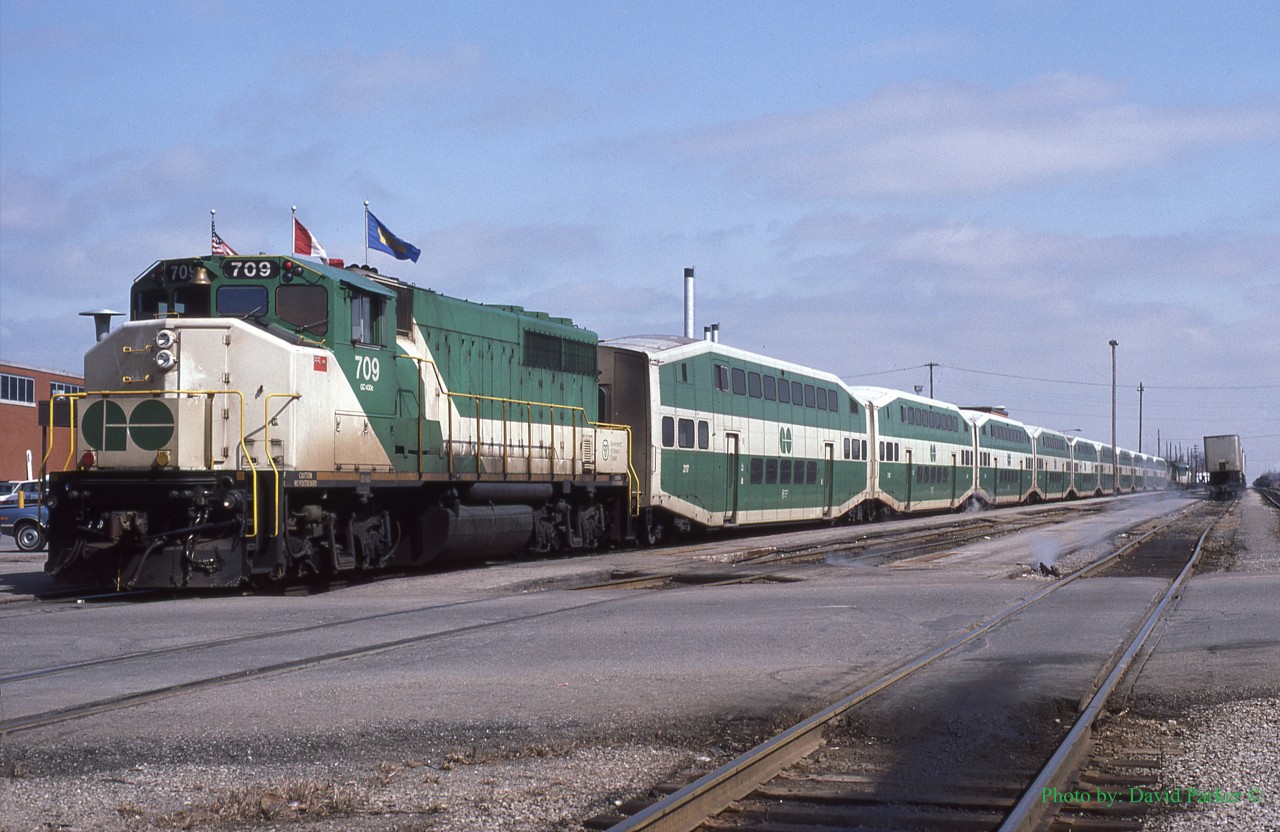 GO equipped VIA 76 prepares to depart Windsor (Walkerville). GP40-2W GO 709 with red marker lights illuminated brings up the rear with an APCU/GP40 consist up front.