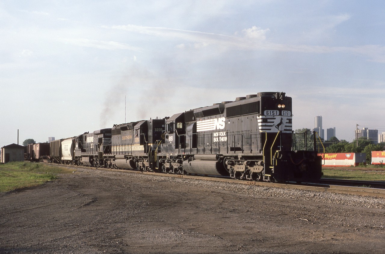 The NS "Puller" crests the grade out of the Detroit River Tunnel and is about to pass Windsor South on its run from NS Oakwood Yard in Melvindale MI to the CP Windsor Yard. July 19th 1986.
