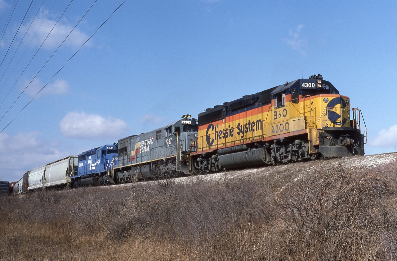 CSXT NI-42 sets off cars for CN at Van De Water Yard, Windsor, Ont. March 2nd 1987.  Whats unusual today is not the ex Seaboard System U-Boat, but the Conrail SD40-2.