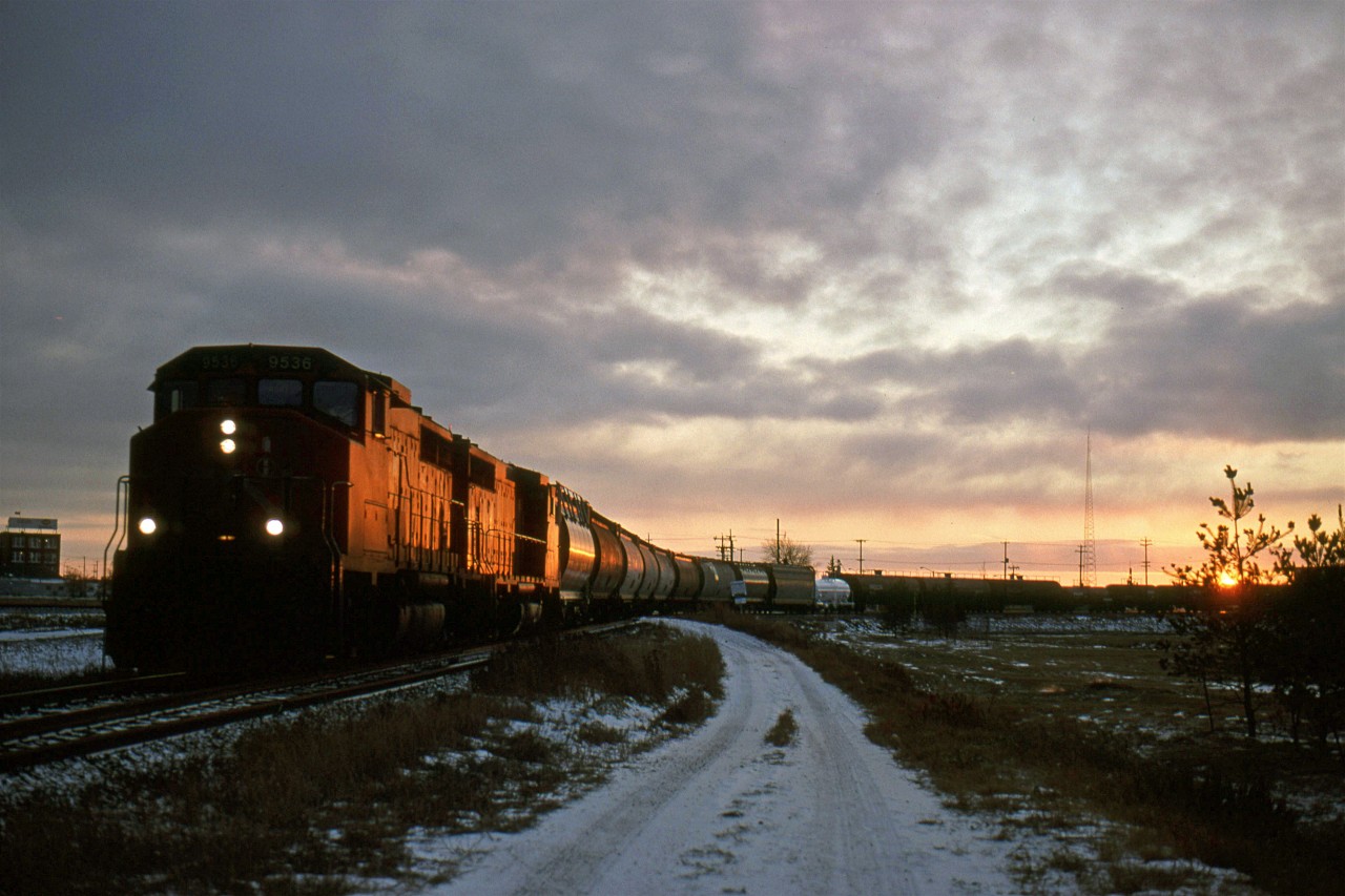 526 was the chemical local out of Calder/Walker Yard that went up to Scotford yard (fort Saskatchewan) to switch the yard, and possible some of the chemical plants on the south side of the North Saskatchewan River (opposite the Beamer Spur). I am not certain if it became another train in Scotford, or whther it returned to Edmonton as 526.
At extreme left can be seen the Swift Premium packing facility.