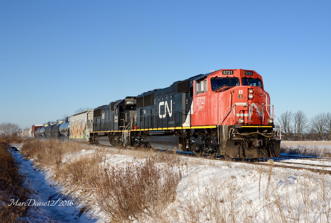 CN 5721 with IC 1003 lead train 384 out of Sarnia east bound at Waterworks Road.