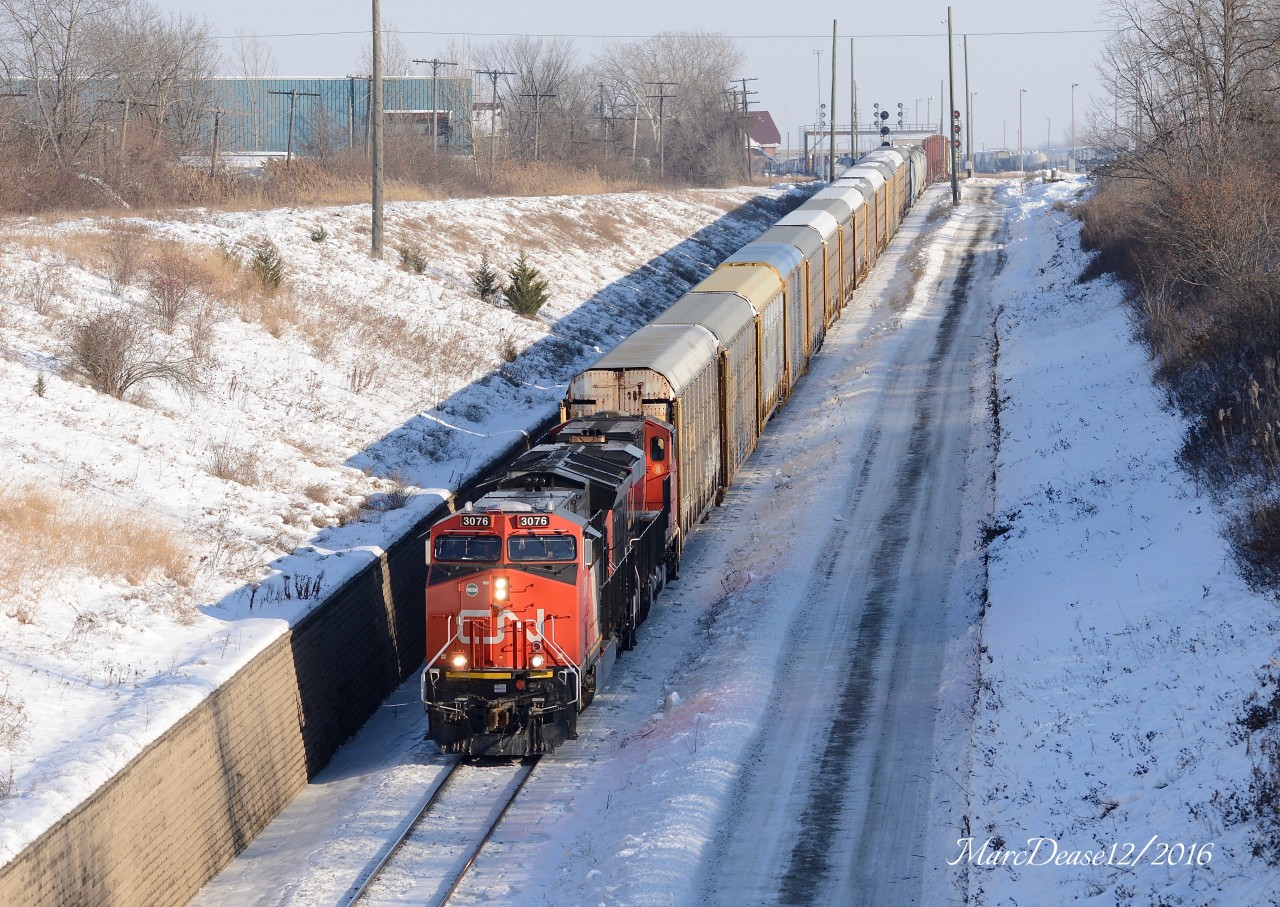 Train 387 heads for Port Huron, Mi., via the Paul M. Tellier Tunnel under the St. Clair River with CN 3076 and CN2836.