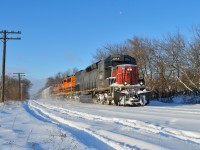 On a frigid December morning, as evidenced by the nose of 3054, GEXR 432 kicks up the snow as it comes off the downhill grade into Guelph with 258 axles on the drawbar.