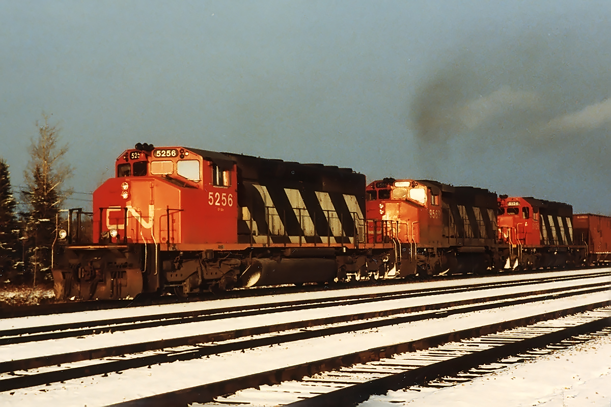 The train of choice for me was the sulphur trains although I didn't see any, any none from above where the brilliant yellow powder made such a nice change from the norm. But here, 3 GM's of 3 different types charge out of town with 120 cars bound for Vancouver. Train was made up of CN hoppers rather than Sultran.