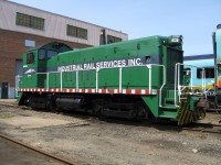 The Industrial Railway Services shop switcher IRSI no. 1001 sits beside the former CN Gordon Yard diesel shop.