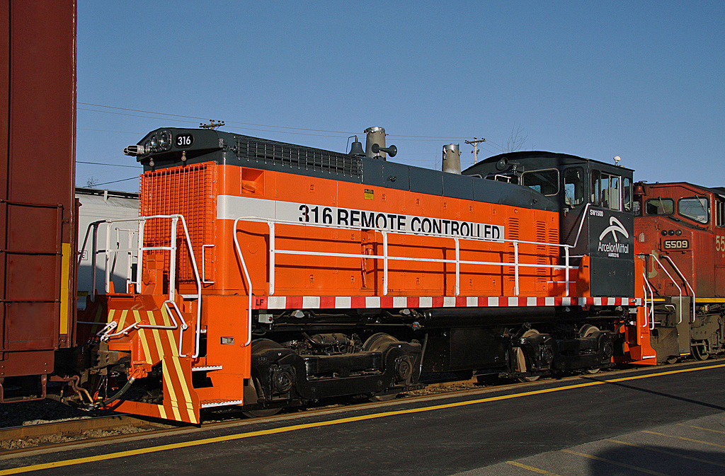 ArcelorMittal EMD SW1500 no.316 newly rebuilt, passing through Bathurst, N.B. on a northbound CN train, Nov. 05, 2009.