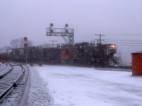 Long winter ahead. As I post this, winter is due tomorrow. And this swirling snow image of a CN transfer working back to Hamilton was taken on the fourth day of April !! I had written '1244' for the leader and left the other two SW1200RS numbers as question marks, but now I wonder how I could have even read the first unit.