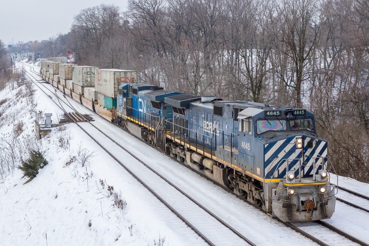 Blue Christmas... On a misty Christmas Eve, Canadian National hotshot train no. 148 cruises through Bayview Junction behind a pair of big blue GEs. This train made for a nice 'early Christmas gift', as I was en-route to the mall to finish some last minute shopping when I paid a brief visit to the Junction.

I hope everyone has a very merry Christmas, and the only thing blue is the locomotives that you photograph!
