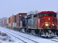 Q14891 12 rolls through Brantford with CN 2400, CN 2226, and 178 cars.