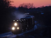 After being overtaken by 2 VIAs, CN 306 finally makes its way in the twilight.