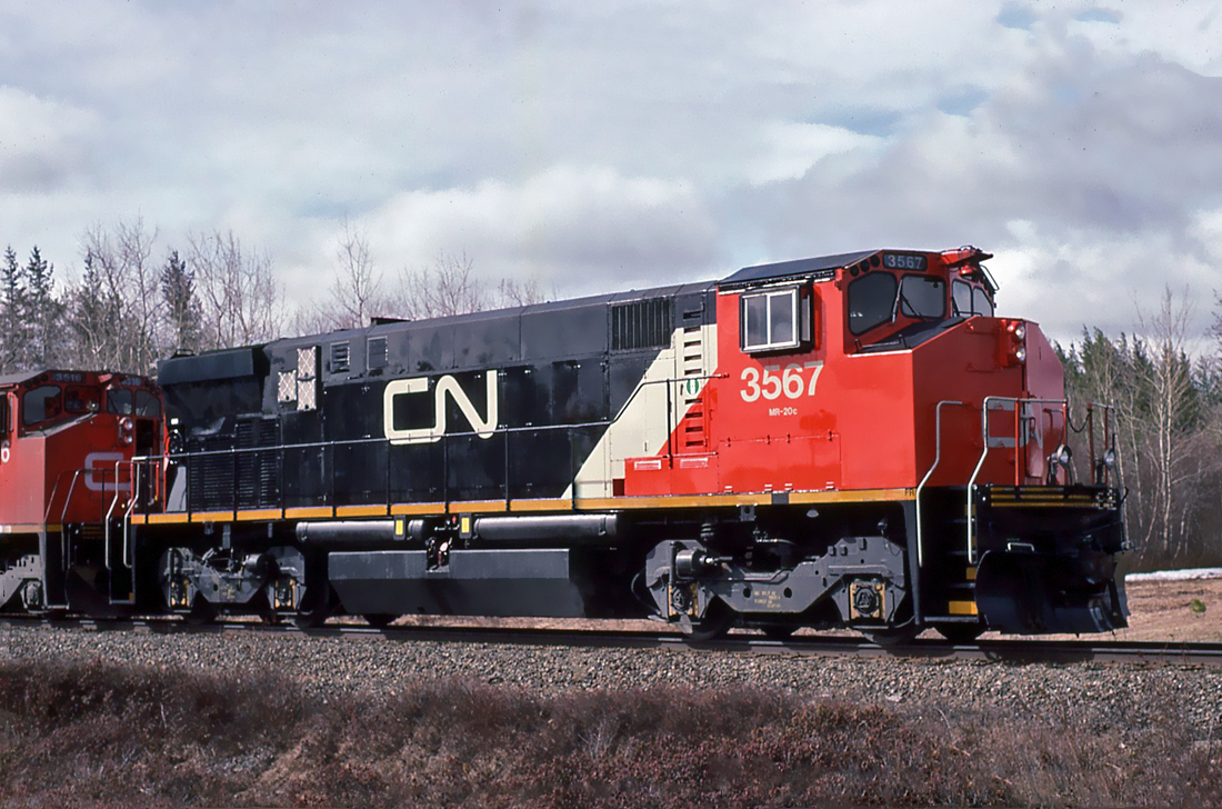 Only two CN MLW M-420Ws received this paint work, units 3536 and 3567. Photo taken at Kent Junction, N.B. May 01, 1993.
