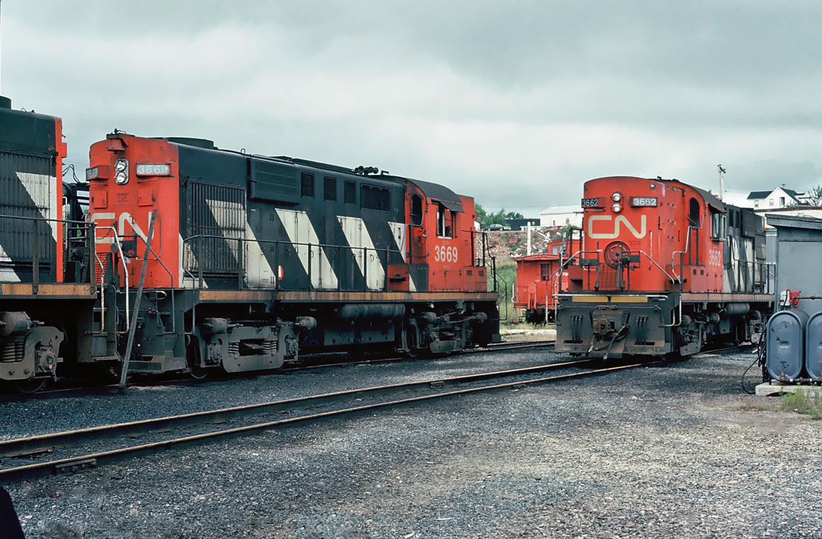 CN MLW RS-18 Nos.3669 and 3662 in Bathurst CN yard, October 05, 1982.