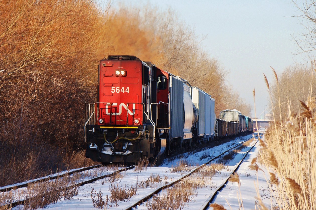 CN 5644 is seen here heading southeast along the CASO with 438's train bound for London, having just crossed through the crossover near Howard Ave. to get onto the south track. The train would then head straight to Essex where the rails curved northeast, nearly pointing straight to Fargo where the line ended and connected with the CSX Sarnia Sub.
