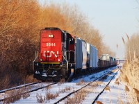 CN 5644 is seen here heading southeast along the CASO with 438's train bound for London, having just crossed through the crossover near Howard Ave. to get onto the south track. The train would then head straight to Essex where the rails curved northeast, nearly pointing straight to Fargo where the line ended and connected with the CSX Sarnia Sub.