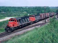 CN Rail GMD SD40 No.5082 with GP40-2LW No.9422 E/B leaving Bathurst, July 03, 1983.