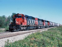 Westbound CN SD40 5232 and 5012 with GP40-2LW 9565 drifts into Moncton and on to Gordon yard for a crew change. Sept. 25, 1988.