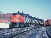 CN MLW FPA-4 6783, GMD F9B 6602 and CLC CPA16-5 6701 are going to CP's Windsor Station for a late afternoon departure of the CN-CP Pool train The International bound for Toronto. March 11, 1965.