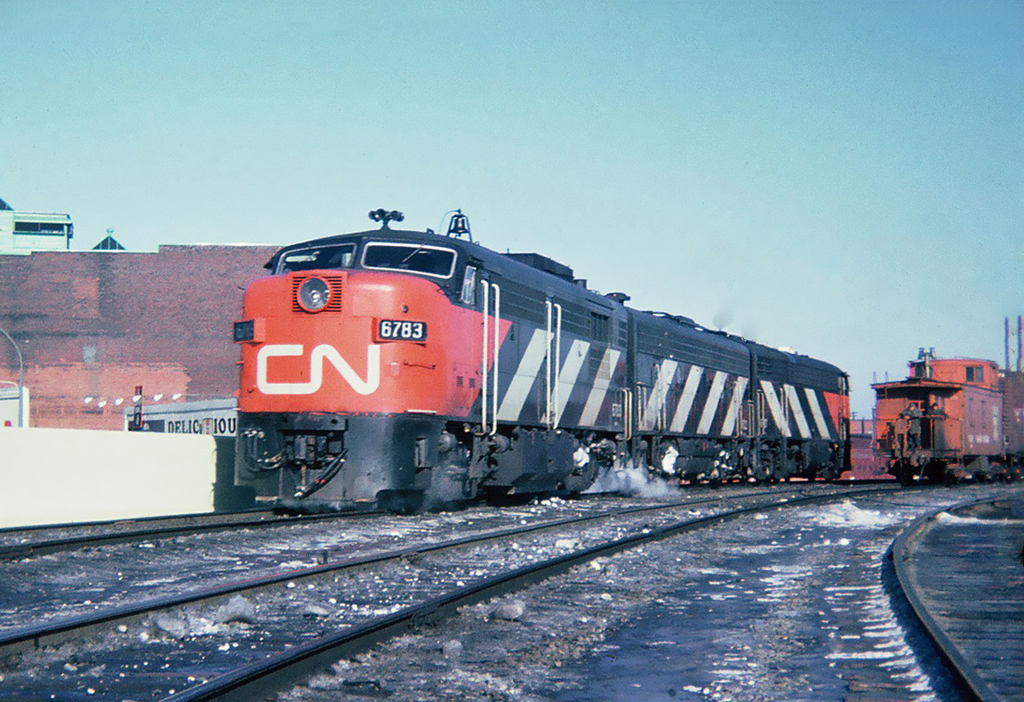 CN MLW FPA-4 6783, GMD F9B 6602 and CLC CPA16-5 6701 are going to CP's Windsor Station for a late afternoon departure of the CN-CP Pool train The International bound for Toronto. March 11, 1965.