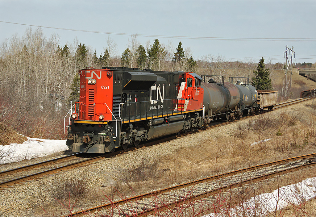 Eastbound CN 402 with SD70M-2 No.8921 working long Hood forward with only three cars in tow.