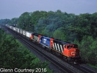 Another Bayview shot, almost 10 years before the last one I posted. The eastbound Laser has travelled overnight from Chicago. Today's train has a GTW GP40-2 (former DT&I) as the meat in a GP40-2W sandwich, this was fairly common on the Laser. Also note that there is nothing but trailers in well cars on the head end of the train. 