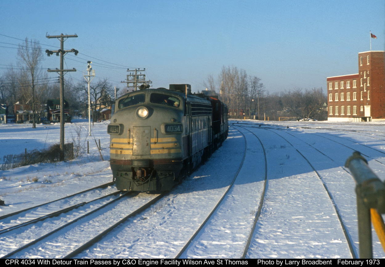CP 4034 Passes C&O Wilson Ave Engine Facility in St Thomas with a Detour Train. I believe it was the Acid Train using the CP St Thomas and the C&O to bypass a wreck at Thameville  February 1973