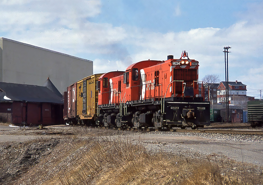 Two CP MLW RS-23 No.8034 and 8027, transferring cars to CN yard at Saint John, New Brunswick April 1990.
