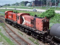 CP Rail MLW RS-23 Nos.8035 and 8037 on a Tansfer run in CN yard Saint John N.B. June 24, 1989.