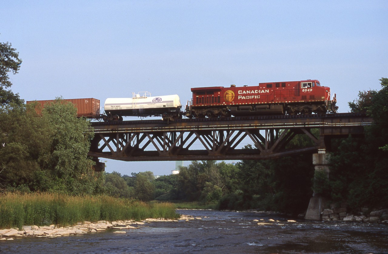 Good old CP 153 (formerly 503) crosses the Credit River in Streetsville ON with one of it's trademark tankcar's on the head end.