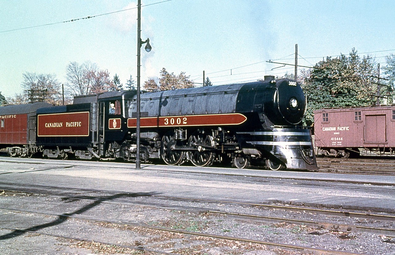Canadian Pacific train #360, normally two RDC cars, was frequently too big and conventional power with passenger cars were added, sometimes with the RDC cars included in the train serving as coaches.  CPR Jubilee 3002 is #360's power today, pictured by the station in Galt in November 1953. It was one of five streamlined F2a-class 4-4-4's built by MLW in 1936 for fast passenger service, and assigned to Toronto-Windsor duties with sister 3000. 20 more similar (but less streamlined) 2900-series F1a Jubilees were ordered from CLC the following year.

(Original photographer George Schaller, duplicate slide from the collection of Bill Thomson and posted on behalf of and with Mr. Schaller's full participation).