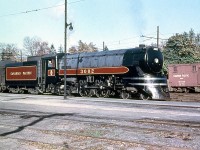 Canadian Pacific train #360, normally two RDC cars, was frequently too big and conventional power with passenger cars were added, sometimes with the RDC cars included in the train serving as coaches.  CPR Jubilee 3002 is #360's power today, pictured by the station in Galt in November 1953. It was one of five semi-streamlined F2a-class 4-4-4's built by MLW in 1936 for fast passenger service, and assigned to Toronto-Windsor duties with sister 3000. 20 more similar (but less streamlined) 2900-series F1a Jubilees were ordered from CLC the following year. All CP's Jubilees were scrapped at the end of steam, except 2928 (at CRM/Exporail) and 2929 (at Steamtown).<br><br>(Original photographer George Schaller, duplicate slide from the collection of Bill Thomson and posted on behalf of and with Mr. Schaller's full participation). 