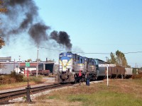 For D&H fans, this is about as exciting as it gets in Ontario. I was profoundly shocked to see on a nice warm afternoon in late October a pair of 'lightning stripes' roll off the International Bridge at Fort Erie. And doubly so when they proceeded to take the old 'Dunnville' line (gone now) which curved west along the south side of the CN shop area. This photo shows a mini-conference as I guess they wanted to make sure they knew what the procedure was, as this was a very rare move. I had never seen it before nor since. The transfer pulled down the Dunnville Sub in order to back the train around the Wye and into the yard for reasons I never did find out. Normally the transfers run directly into the yard, drop their train and then reverse up the next track to pick up traffic to take back to the States.  Not today. And a pair of old smokey 1961 era RS-11s!!!! This D&H fan from way back was in a state of advanced dribbling and drooling, I can tell you that!!!  For the record, power is D&H 5009 and 5005.