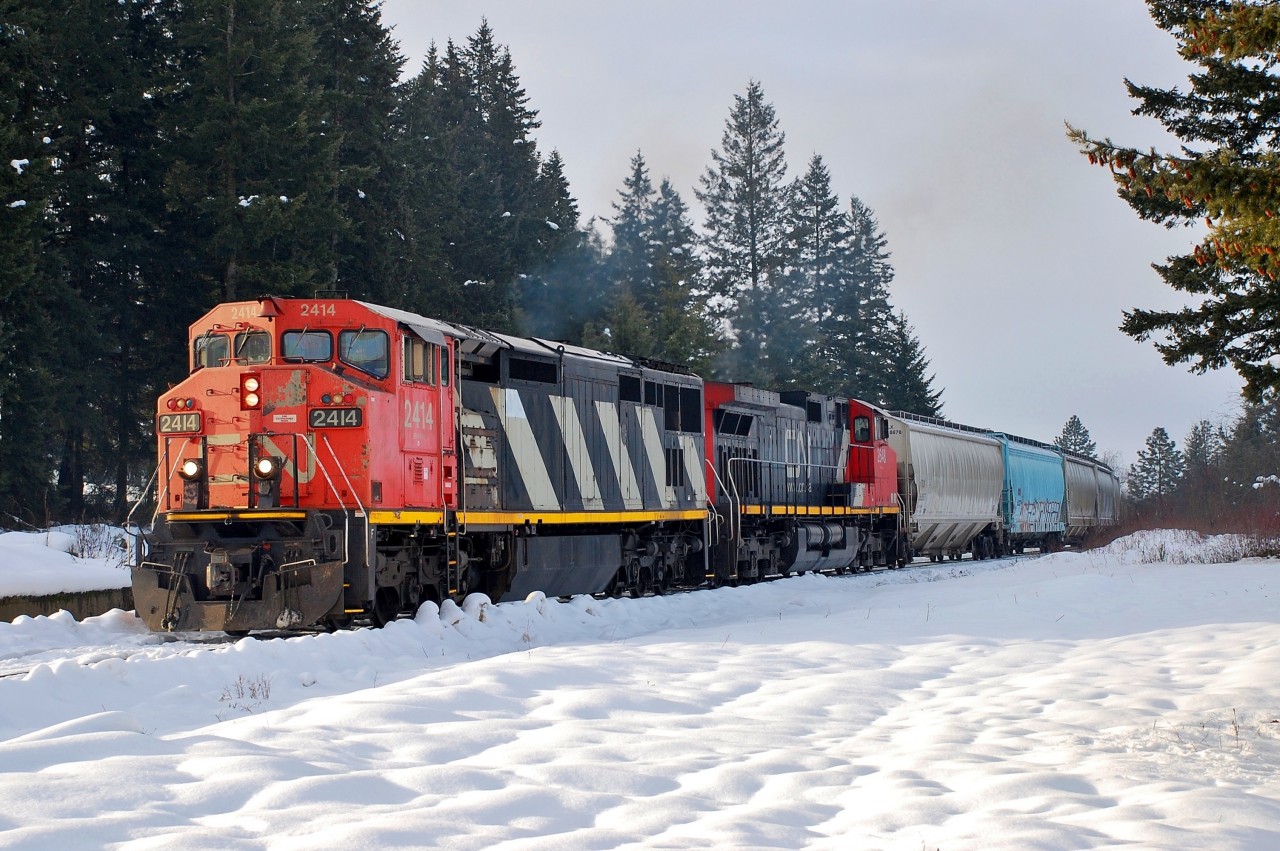 CN nos.2414&2648 are leading a northbound mixed freight out of the Industrial Park in Spallumcheen.