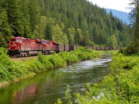 A westbound coal train is winding through the "Enchanted Forest" behind CP nos.8827&8862.