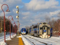 AMT 1359 is leading a westbound out of Montreal West at left, while snow-covered multilevel cab car AMT 3018 brings up the rear of an eastbound at right. AMT engines are no longer found on the western end of trains that pass through Montreal West, unfortunate for photographs in the afternoon/evening.
