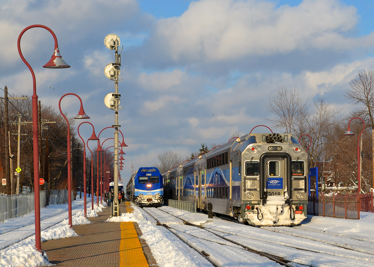 AMT 1359 is leading a westbound out of Montreal West at left, while snow-covered multilevel cab car AMT 3018 brings up the rear of an eastbound at right. AMT engines are no longer found on the western end of trains that pass through Montreal West, unfortunate for photographs in the afternoon/evening.