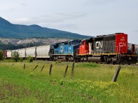 An interesting lash-up with CN 5351 running long hood forward in combination with a rare visitor IC 2460. This mixed freight is about to depart from the outskirts of Armstrong and head north to Kamloops.
