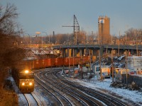 NS 7698 leads a short CN 529 on the transfer track of CN's Montreal Sub not too long before sunset.
